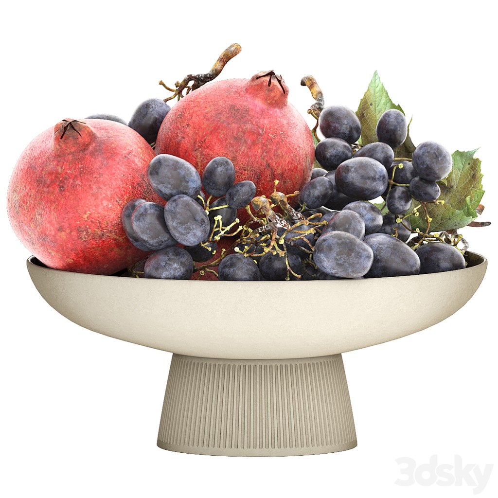 bowl of black grapes and pomegranate fruit